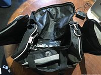 Bag open showing interior wet pocket lining and end compartments