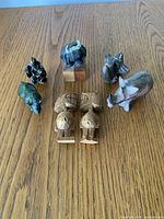 Group view of all seven figurines on table