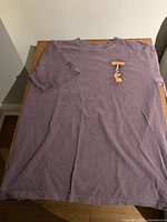 Front view of purple Wine Dyed T-shirt showing small chest graphic