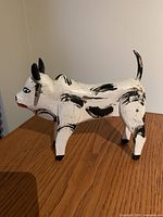 Left side view of hand-painted wooden bull