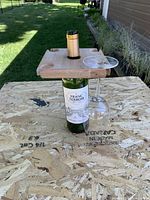 Holder on wine bottle showing glass support layout