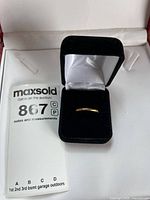 Ring in open box showing front view