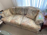 Front view of Barrymore floral sofa with two matching pillows
