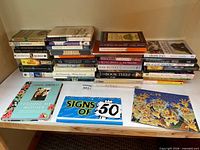 Full lot overview with three stacks and front display of larger books