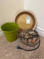 All three items grouped: green planter, Calias bowl, grey fountain bowl with stones and cord