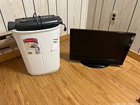 Dynex TV next to Maxtek shredder in bin