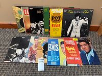 Group shot of all Elvis Presley LPs upright and laid flat