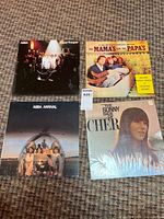 Group shot of the four record sleeves