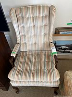 Full front view of Harden striped wingback armchair
