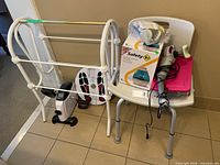 Group shot of towel rack, pedal exerciser, Dr. Ho’s foot pads, shower chair with humidifier box and massager