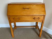 front view closed showing overall desk form and lower drawer