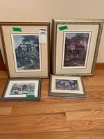 All four framed Keirstead prints standing against wall