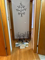 Hallway overview showing wall tree candleholder and grouped items below