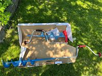 Both augers in and beside Nordmark box on grass