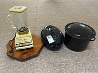 All four items grouped: blender, lazy Susan, roasting pan with lid, stock pot with lid