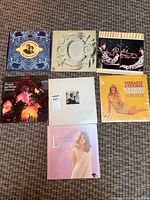 All seven LP records laid out together