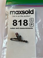 Full lot view showing thistle pin on label