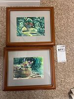 Both framed paintings side by side showing overall lot