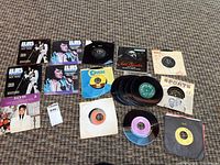 All records and cloth laid out on carpet