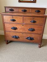 Front view of dresser showing drawers, hardware, feet