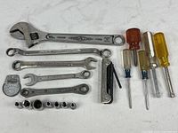 Overview of all hand tools laid out on surface