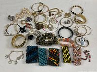 Overall view of entire jewelry lot spread out