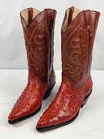 Full view of both boots standing upright