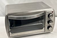 Front view of stainless Oster toaster oven with closed door