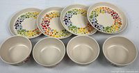 Full set: four plates above four bowls showing pattern and count