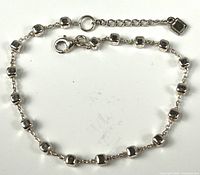 Full view of sterling silver cube bead bracelet with extension chain and clasp