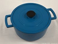 Lidded blue enameled cast iron Dutch oven top view