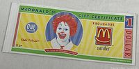 Front of McDonald’s $1 gift certificate showing Ronald McDonald and denomination
