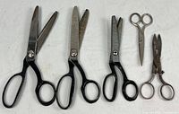 Group view of all five pairs of scissors laid flat