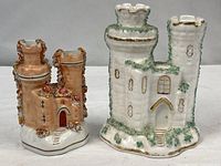 Front view showing both castle spill vases for size and style comparison
