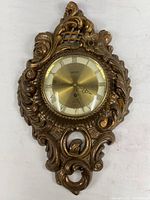 Full view of ornate gold-tone Welby Syroco wall clock