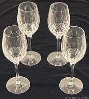 Four Waterford Alana crystal wine glasses standing together