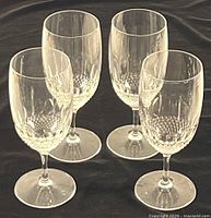 Group shot of four Waterford Maeve pattern goblets