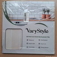 Front of VaryStyle package showing branding and beige tile sample window