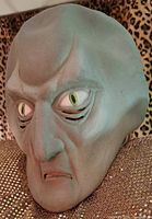 Front angled view of Balok mask showing facial detail and eye inserts