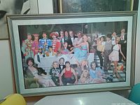 Full view of framed poster on wall showing artwork and frame