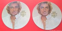Front view of both picture discs showing images and titles