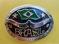 Front of oval belt buckle showing Brasil flag design and lettering
