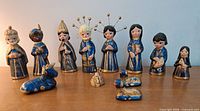 Full set of 12 painted metal nativity figures displayed