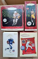 Group shot showing all four boxed Hallmark sports ornaments