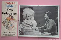 Front view of autographed Polyester card beside framed Divine & Letterman photo