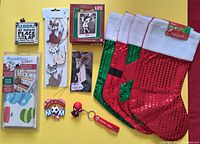 All items grouped: decals pack, fox ornaments, Hallmark ornament box, desk plaque, keychains, soccer mom ornament, three red sequin stockings