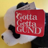 Close-up of Gund panda head with Gotta Getta Gund tag