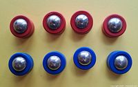 Eight red and blue Rebound puck pieces front view