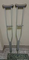 Full view of both crutches standing upright
