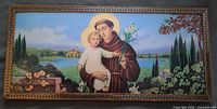 Front view of framed Saint Anthony picture showing image, frame, glass
